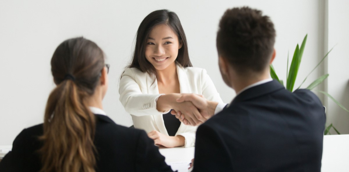 Small business owner shaking hands with contingent workers. Small business owner shaking hands with contingent workers.